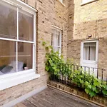 Spacious 1-Bedroom Flat With Private Balcony, Patio, And Traditional Decor In Prime Chelsea Location