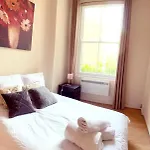 Spacious 1-Bedroom Flat With Private Balcony, Patio, And Traditional Decor In Prime Chelsea Location