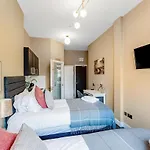 Wake, Sip, Slay Stylish Studio With Cozy Feels 3