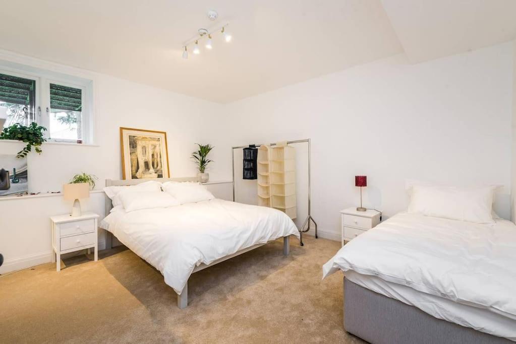 Elegant 2-Bedroom Getaway W Terrace & Garden Views