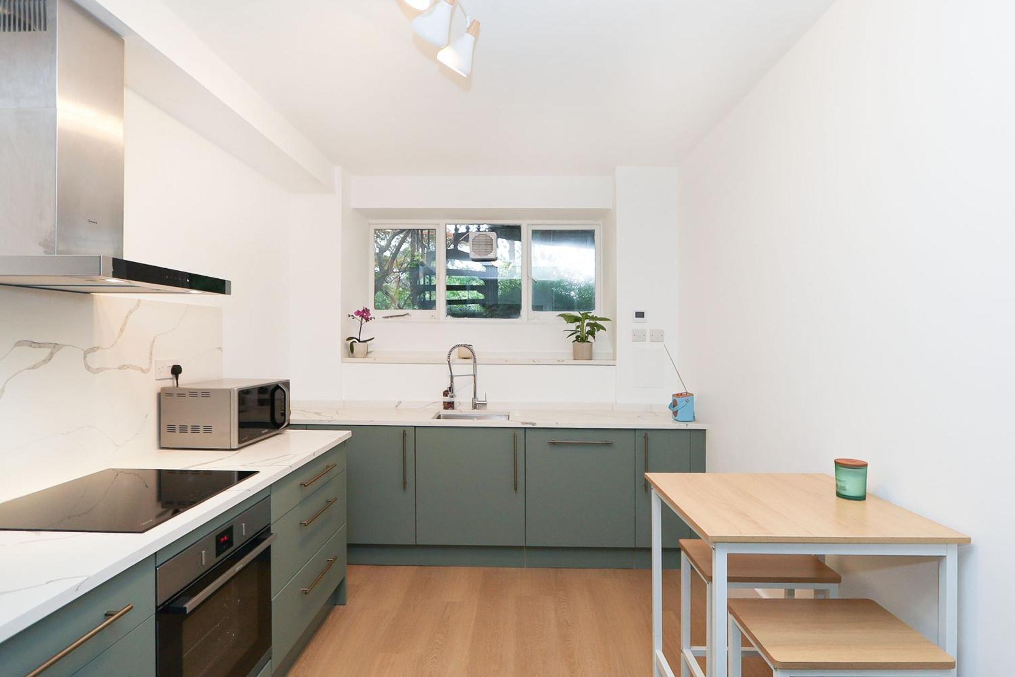 Elegant 2-Bedroom Getaway W Terrace & Garden Views
